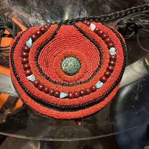 Handcrafted Beaded Necklace with Red and Turquoise Accents
